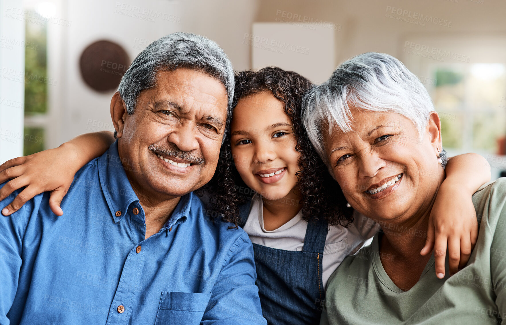 Buy stock photo Shot of a grandchild spending time with her grandparents at home