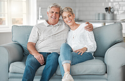 Buy stock photo home, senior couple and portrait on sofa with hug, connection and bonding together in love on couch. House, woman and men on couch in retirement, commitment and security with embrace for smile