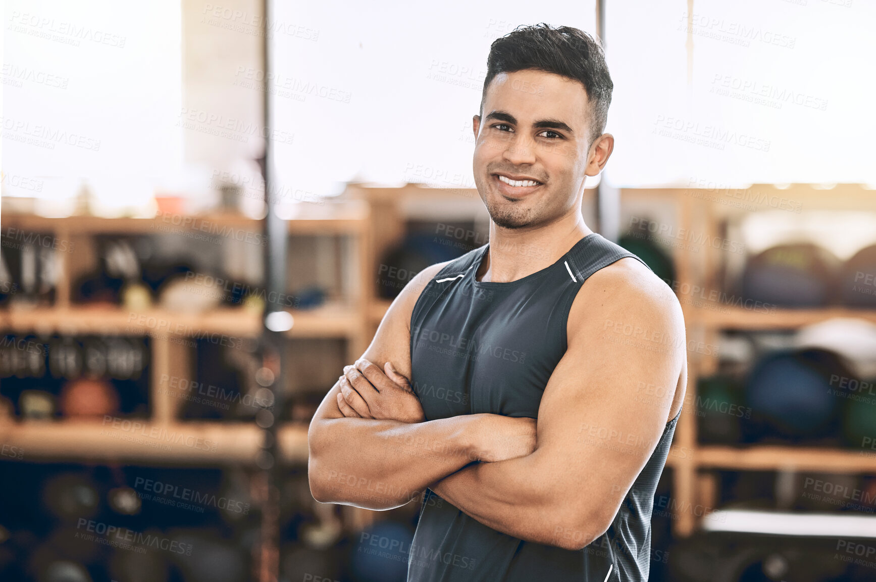 Buy stock photo Man, portrait and confidence in gym for fitness, strength training and exercise for muscle development or growth. Male person, arms crossed and happy in sports center for physical cardio and workout.