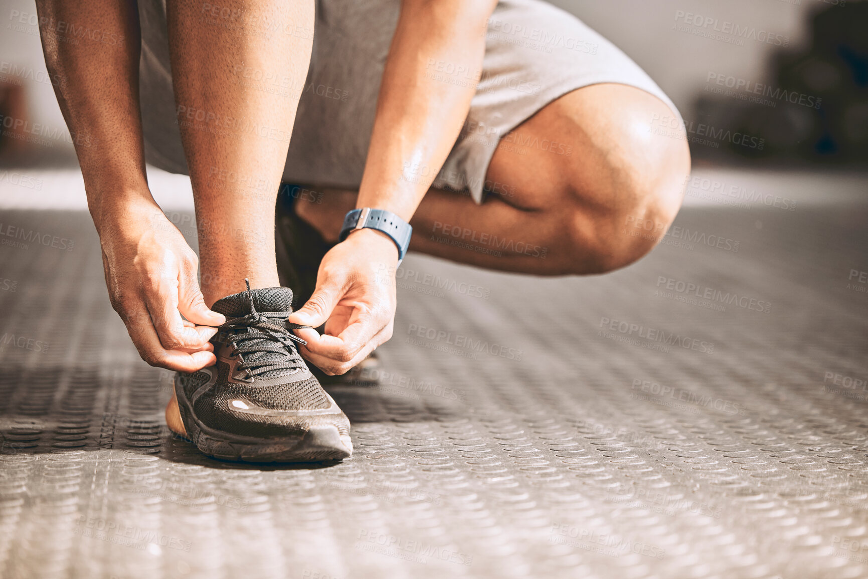 Buy stock photo Hands, sneakers and person tie laces in gym with workout, fitness or exercise for bodybuilding. Shoes, activity and feet of athlete preparing for training, health or weightloss in sports center.