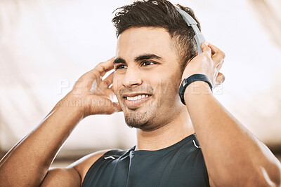 Buy stock photo Fitness, music and smile with man in gym for start of training, wellness or workout routine. Exercise, headphones and thinking with happy sports athlete in health club for challenge or performance