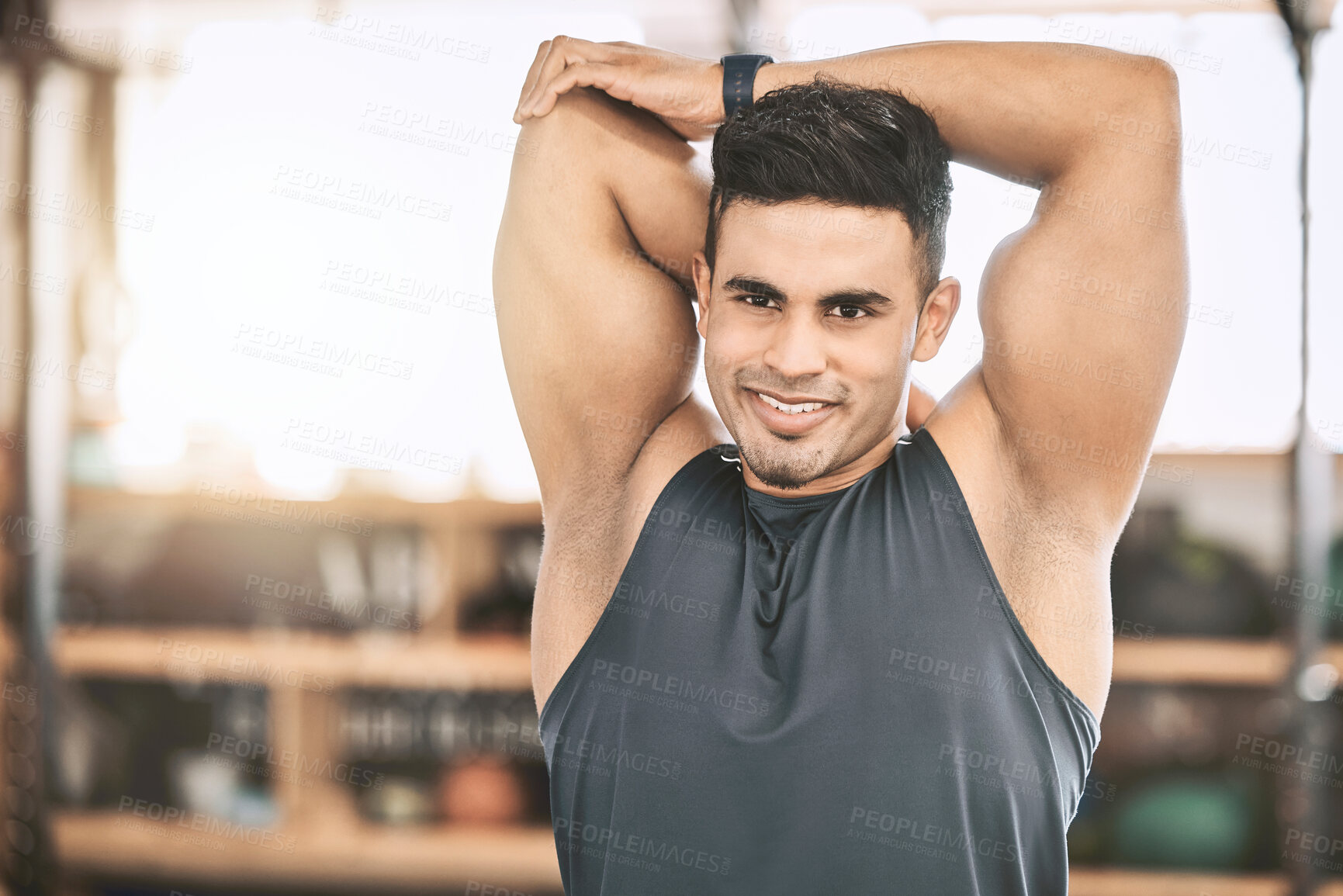 Buy stock photo Fitness, stretching and man in gym with smile, training and happy for workout, routine and morning. Health club, sporty and warm up of shoulder, bodybuilding and exercise of person in weekend