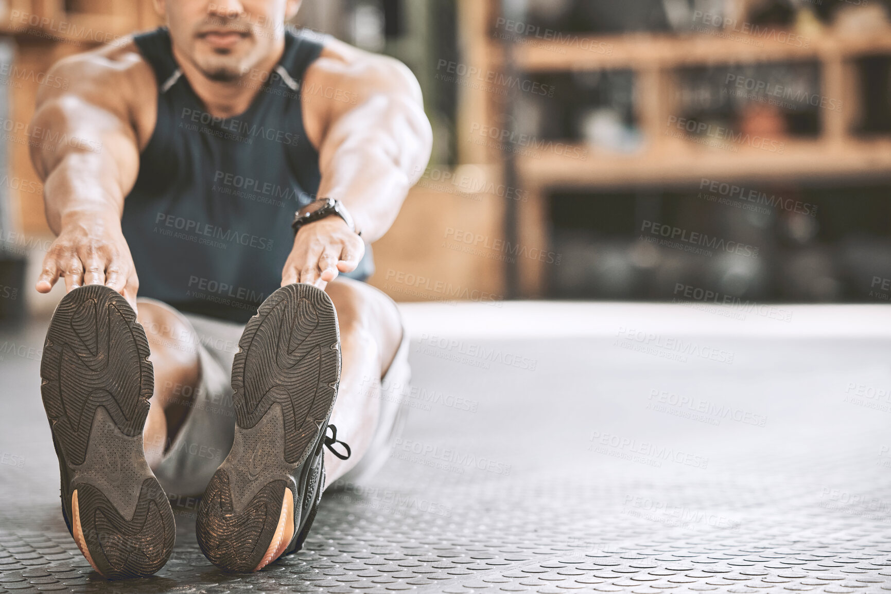 Buy stock photo Fitness, shoes and stretching with man on floor of gym for start of exercise, training or workout routine. Discipline, preparation and warm up with person on mockup space in health club for challenge