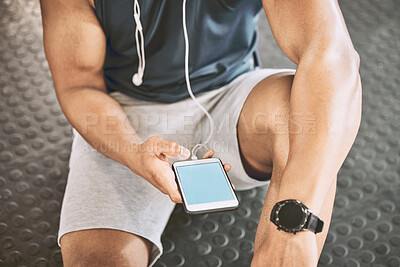 Buy stock photo Fitness, phone screen and watch with man on floor of gym from above for music streaming or progress tracking. Exercise, hand and wellness with sports person in health club for break, rest or recovery