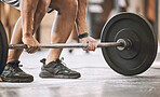 hands of trainer lifting a heavy barbell. Bodybuilder ready to lift weights cropped. Muscular athlete ready to workout. Masculine, sporty fit man lifting heavy weight for bodybuilding.