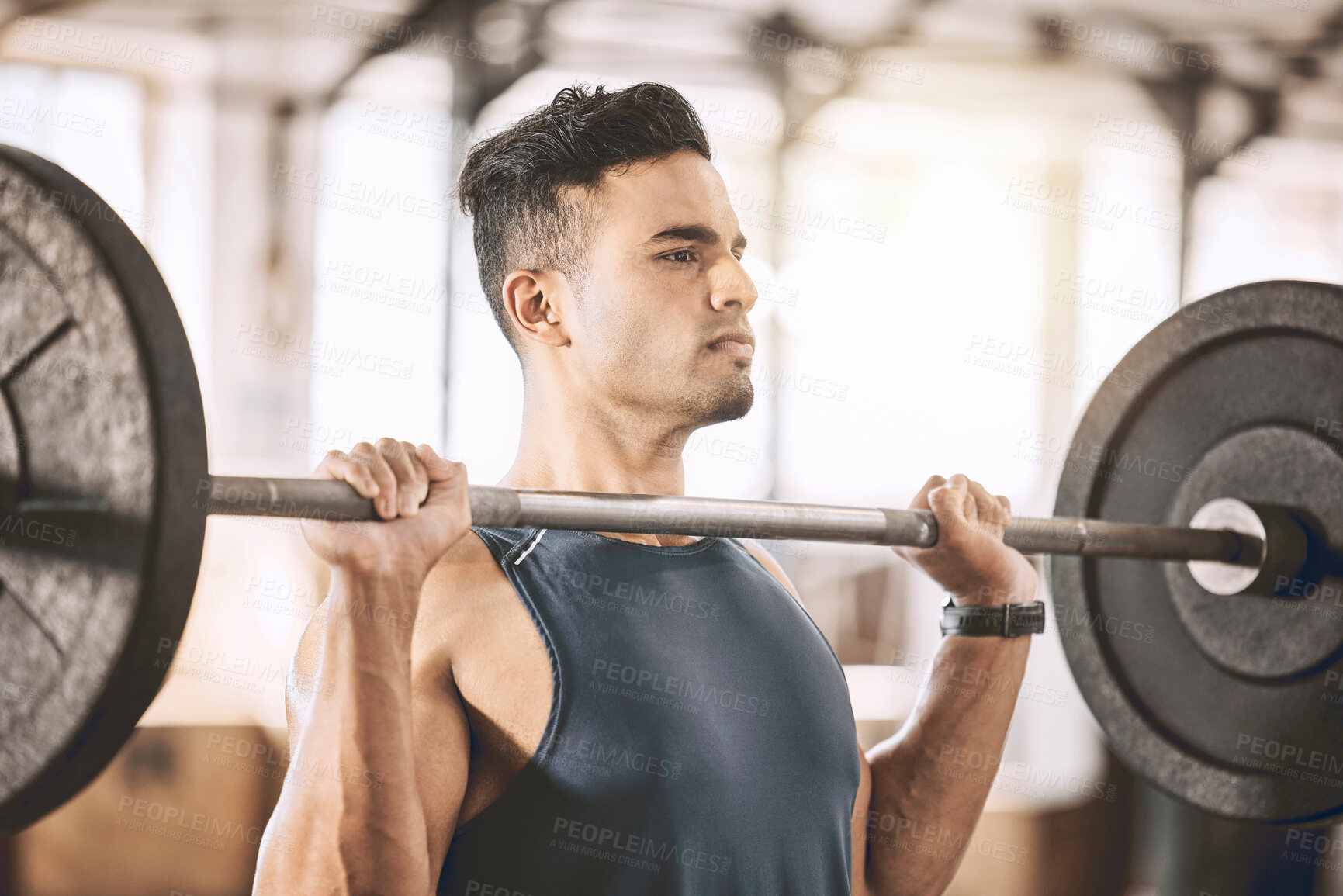 Buy stock photo Serious, man and bodybuilder with barbell in gym for weightlifting, workout and strength training. Athlete, power and person with muscle exercise at health club for fitness, challenge and endurance