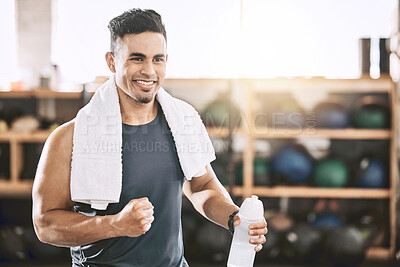 Buy stock photo Man, smile and fist pump in gym for fitness, pride and achievement in session with water bottle. Personal trainer, cheer and happy in sports center for success, energy and inspiration for wellness