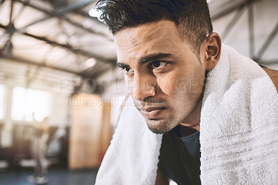 Buy stock photo Fitness, serious and man in gym with sweat for rest with workout, exercise or activity for wellness. Sports, towel and athlete from Mexico with challenge for bodybuilding training in health center