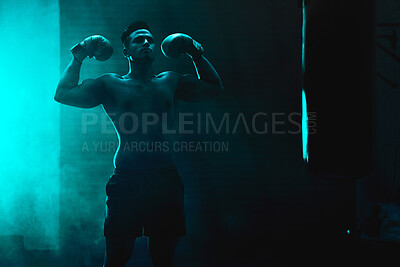 Buy stock photo Silhouette, man and boxer with boxing gloves at gym for martial arts, competition or training. Active, strong male person or fighter with flex by punching bag for muay thai practice at health club