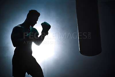 Buy stock photo Man, punching bag and silhouette strong at gym, training practice and attack challenge for combat. Male person, smoke and dojo club aesthetic for boxing competition, athlete and martial arts workout