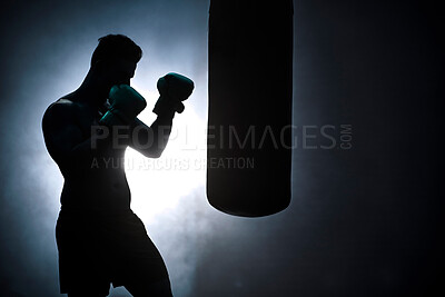 Buy stock photo Man, punching bag and silhouette fitness at gym, training practice and attack challenge for combat. Male person, smoke and dojo club aesthetic for boxing competition, athlete and martial arts workout