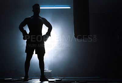 Buy stock photo Man, punching bag and silhouette boxer at gym, training practice and attack challenge for combat. Male person, smoke and dojo club aesthetic for fight competition, athlete and martial arts workout