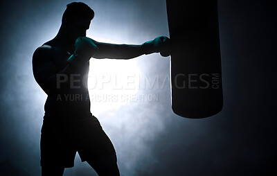 Buy stock photo Man, punching bag and silhouette workout at gym, training practice and attack challenge for combat. Male person, smoke and dojo club aesthetic for fight competition, athlete and martial arts action