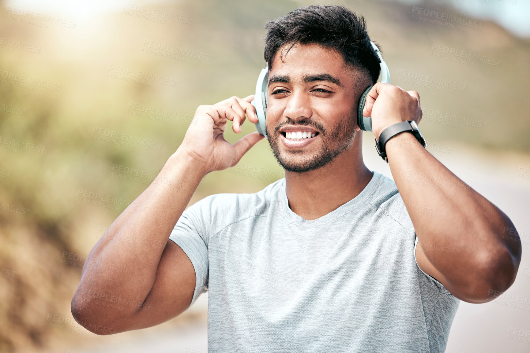 Buy stock photo Headphones, happy and man with smile, fitness and proud of muscle, outdoor and runner in nature for exercise. Confident, sporty and wellness of athlete with workout, audio and music of healthy person