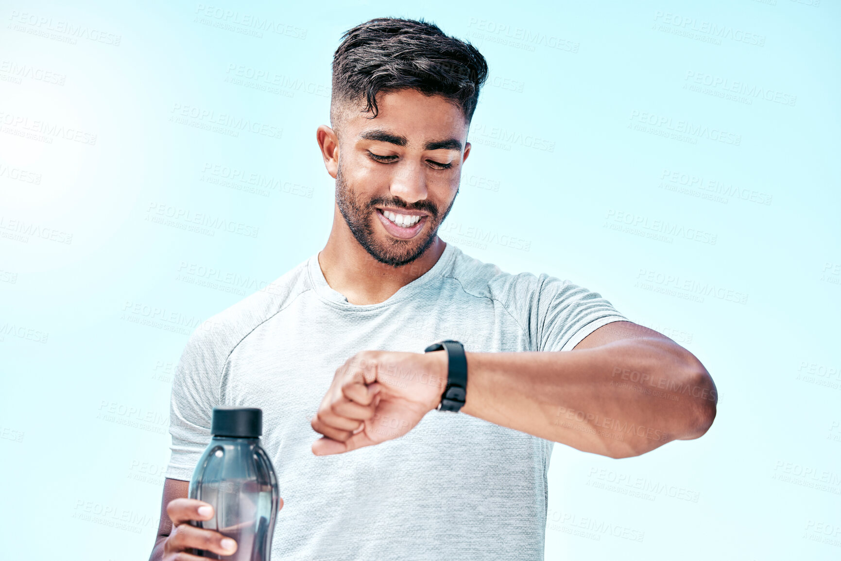 Buy stock photo Outdoor, man and workout with digital watch with smile to monitor or tracking health, wellness and wellbeing. Male person, water bottle and happy with running results, heart rate for fitness