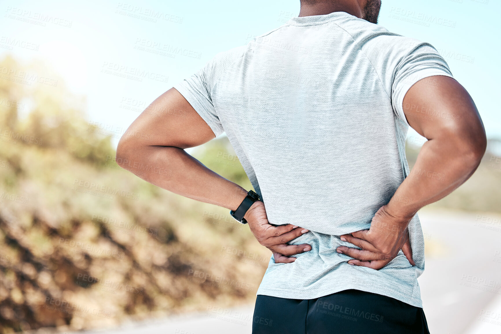 Buy stock photo Back pain, fitness and man with injury outdoor after training, accident, workout or exercise risk. Arthritis, spine and runner with muscle inflammation, problem and hands massage body with backache