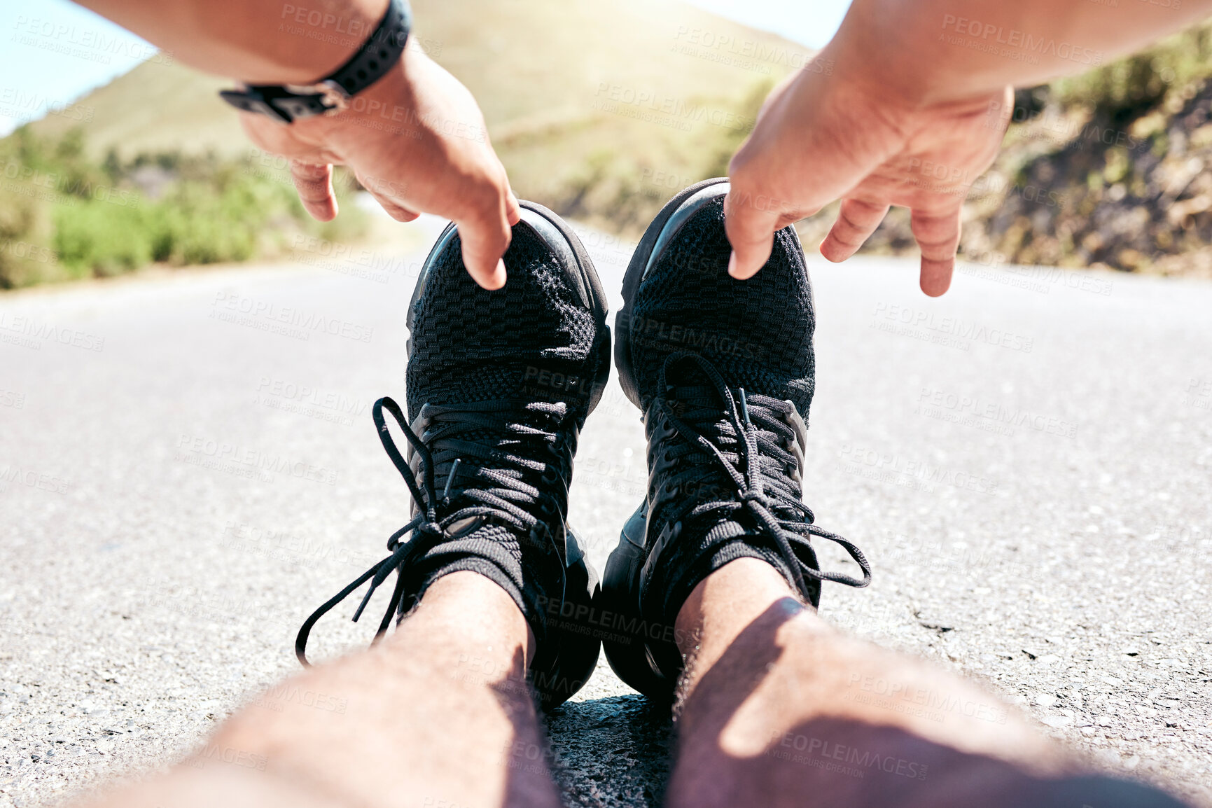 Buy stock photo Stretching, feet and person on pavement for fitness, running and exercise for wellness and pov. Sport, athlete and flexibility with shoes and legs of runner with marathon training on mountain road