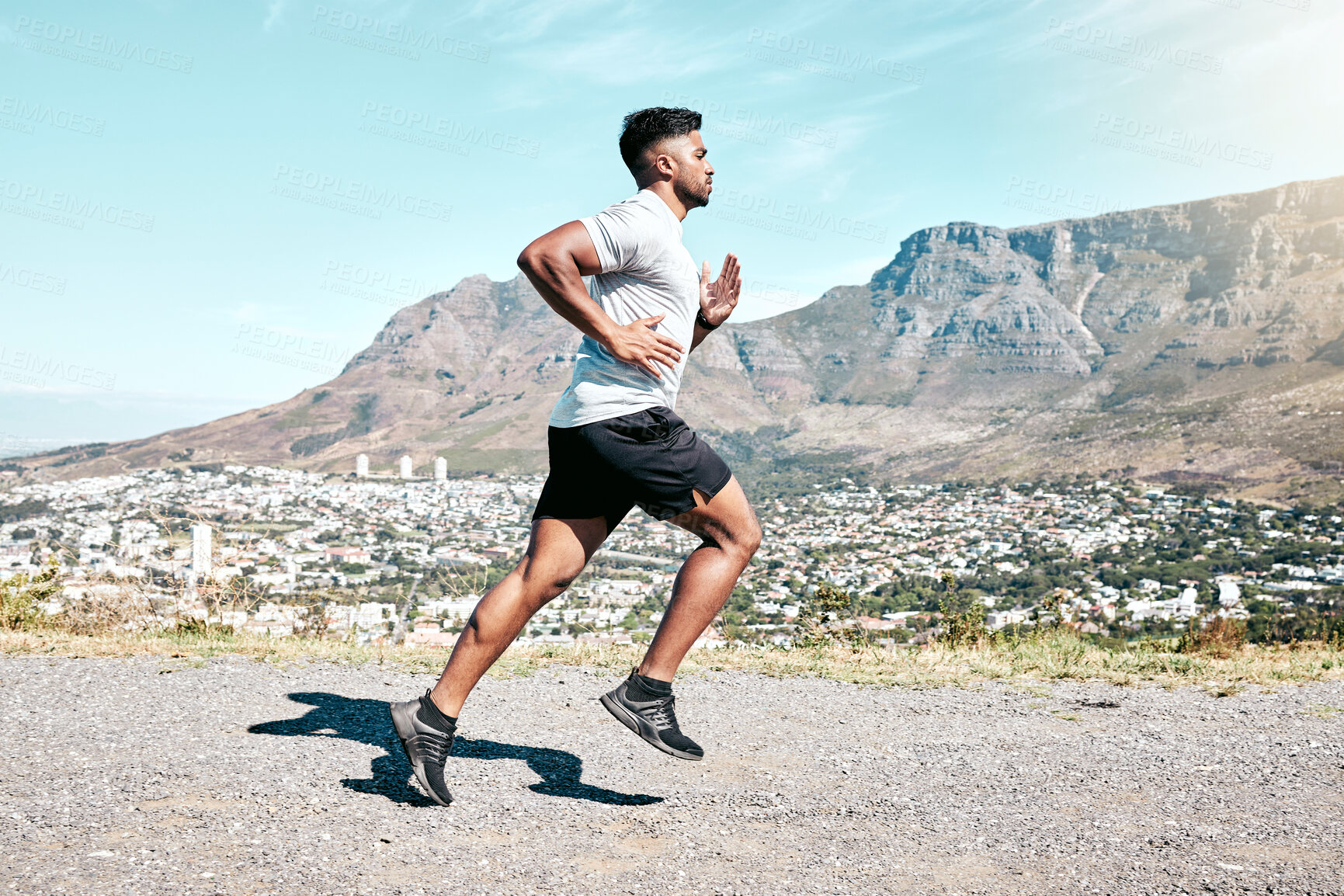 Buy stock photo Running, outdoor and man with energy, nature and fitness of athlete, exercise and routine for race. Challenge, practice and preparing for speed of marathon, training or performance of runner in space