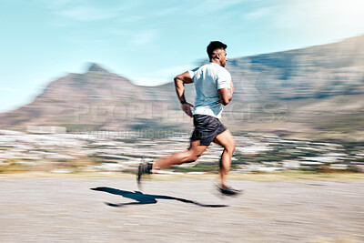 Buy stock photo Outdoor, man and running for fitness on road with exercise, training and workout in Brazil. Male person, motion blur and jogging or race for wellness, wellbeing and self care or health as athlete