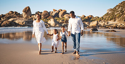 Buy stock photo Family, happy and walking at beach for bonding, travel and vacation with water, sand and rock. Parents, children and people holding hands for relationship, relax and fun holiday in summer with love