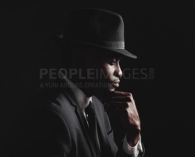 Buy stock photo Thinking, black man and mysterious with suit in dark background for fashion, elegant clothes and crime boss of mafia. Male person, thought and formal outfit for secret spy, security and trendy hat