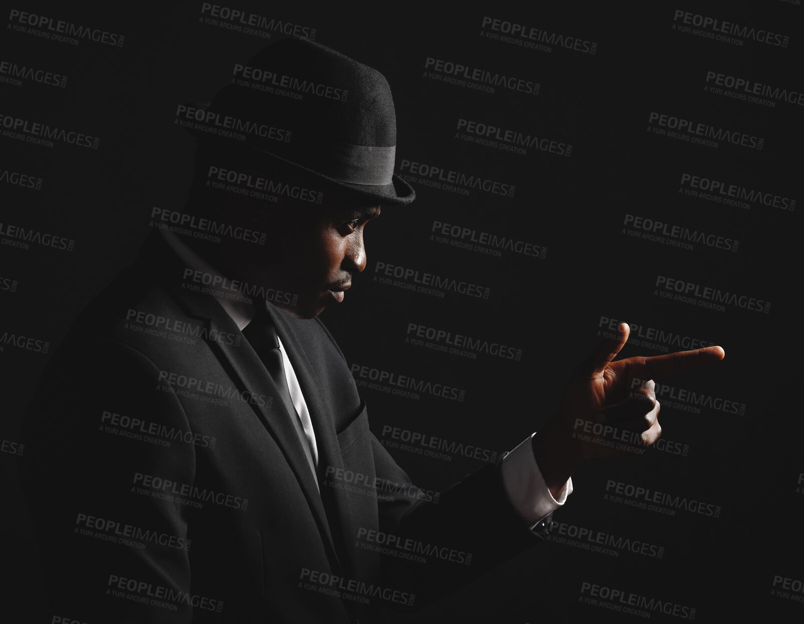 Buy stock photo Black man, finger gun and fashion suit in dark background for agent, elegant clothes and crime boss. Male person, thinking and formal outfit for secret spy, security and criminal danger in mafia