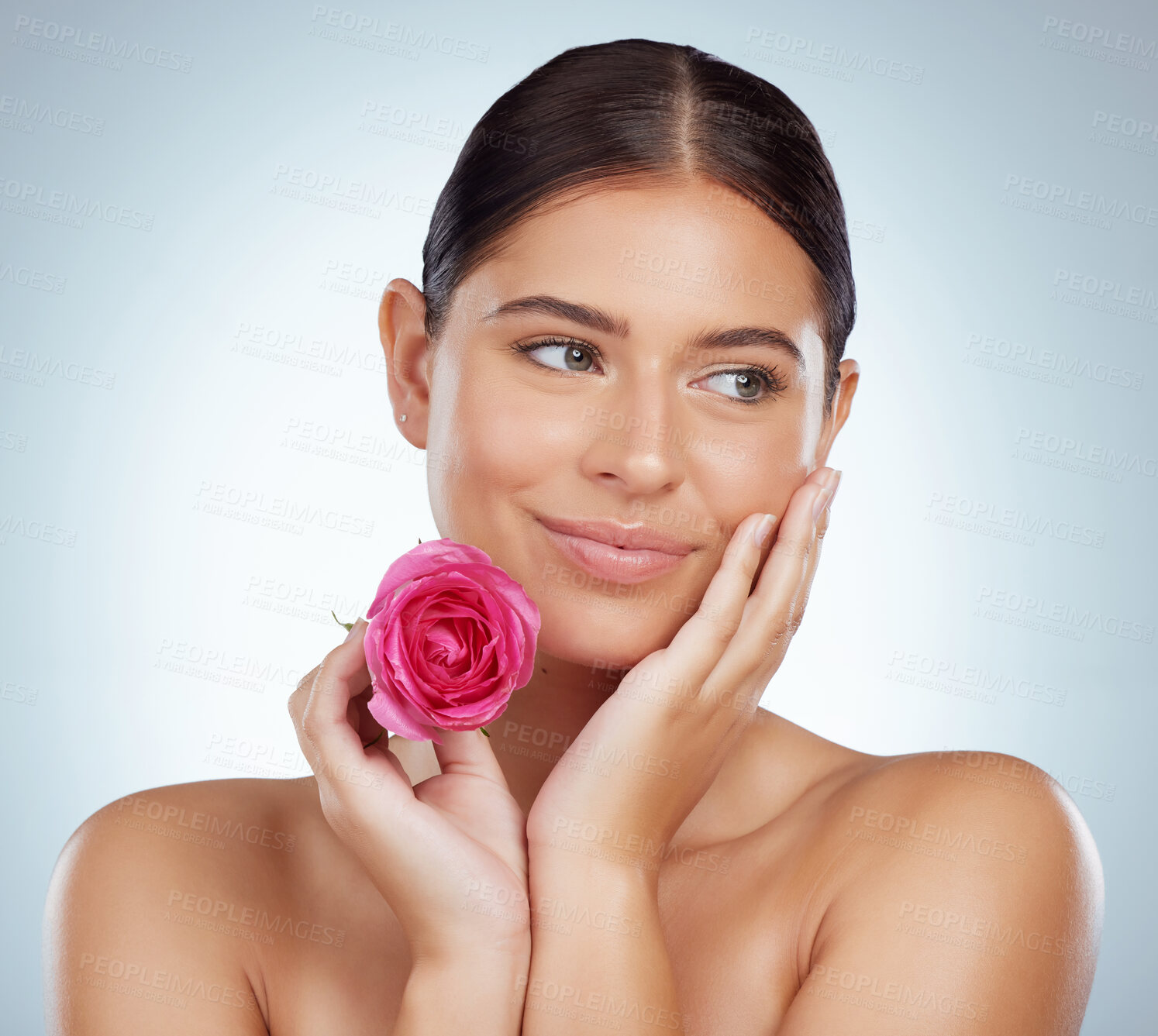 Buy stock photo Woman, face and happy with rose for beauty on studio background with anti aging benefits and glowing skin. Model, person and smile with flower for organic cosmetic treatment and eco friendly facial