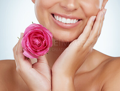 Buy stock photo Flower, smile and woman in studio with skincare, natural beauty and eco friendly dental cosmetics for mouth. Dermatology, facial care and girl with pink rose for teeth whitening on white background