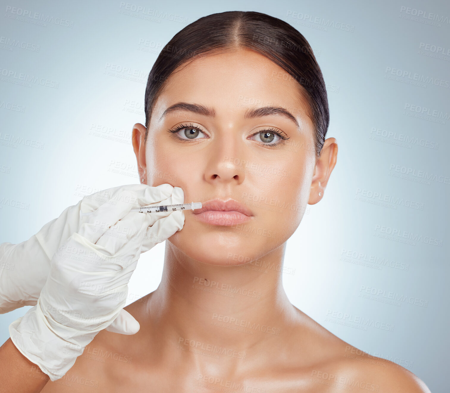 Buy stock photo Plastic surgery, portrait or woman in studio for injection, lip filler or facial treatment. Surgeon hands, needle or person on gray background for hyaluronic acid, collagen implant or transformation