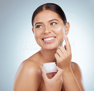 Buy stock photo Skincare, smile or woman on studio background with cream, moisturizer or beauty product. Female person, happy or thinking with tub for dermatology, skin treatment or apply lotion with joy for results