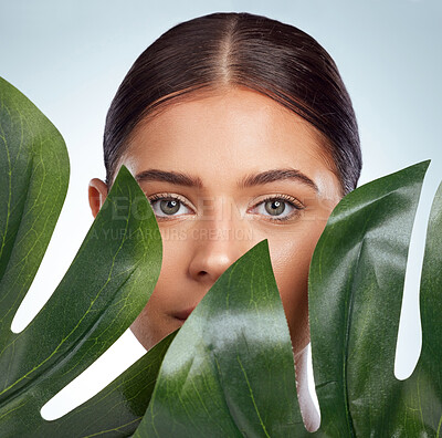 Buy stock photo Palm, portrait or woman with leaf for beauty on white background for aesthetic, skincare or glow. Face, monstera plant or person in studio with healthy cosmetics, facial wellness or collagen results