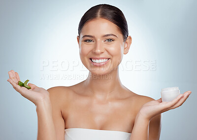 Buy stock photo Portrait, aloe vera and woman with cream, natural cosmetics and dermatology on gray studio background. Face, person or model with organic treatment, beauty or choice with creme or smile with plant