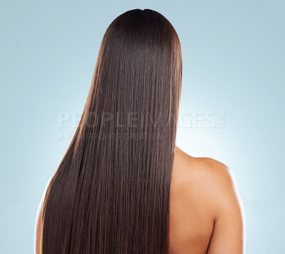 Buy stock photo Back of woman, straight and hair care in studio, keratin treatment and smooth on blue background. Female person, growth and cosmetics shampoo or conditioner for healthy beauty, clean and brazilian