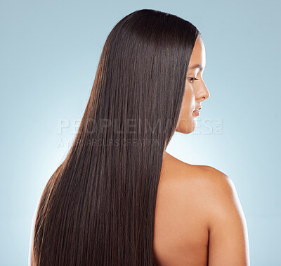 Buy stock photo Woman, straight and hair care in studio profile, keratin treatment and smooth on blue background. Female person, growth and cosmetics shampoo or conditioner for healthy scalp, clean and brazilian