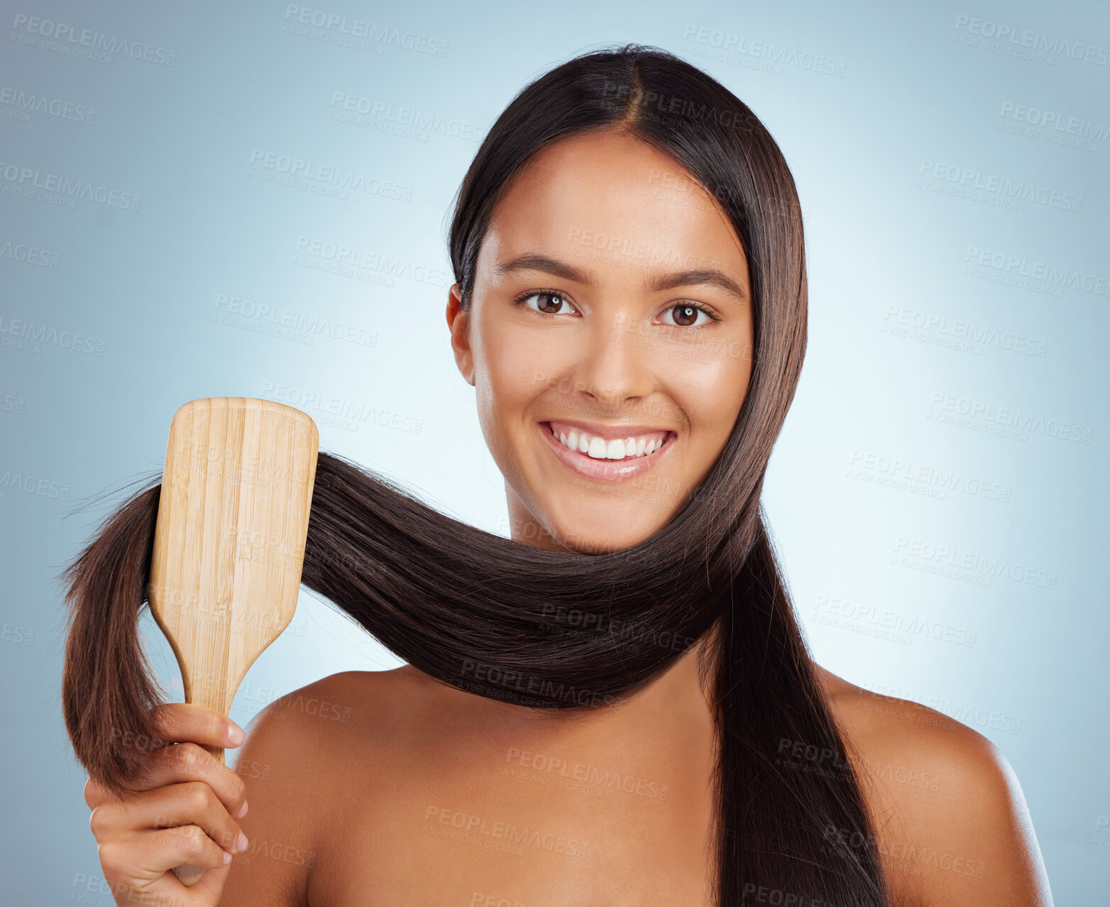 Buy stock photo Woman, brush and haircare in studio portrait, maintenance and grooming routine on blue background. Female person, bamboo and eco friendly cosmetics tool for healthy scalp or growth, smile and clean