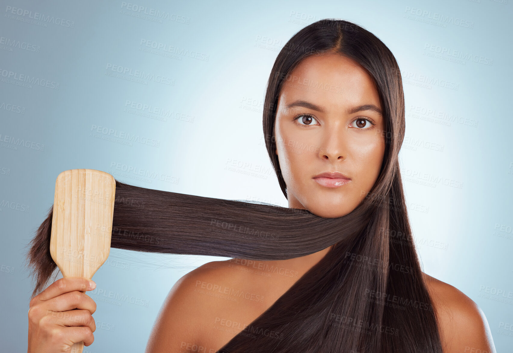 Buy stock photo Woman, brush and studio portrait for hairstyle, maintenance and grooming on blue background. Female person, bamboo and eco friendly cosmetics tool for healthy scalp or growth, beauty and cleaning