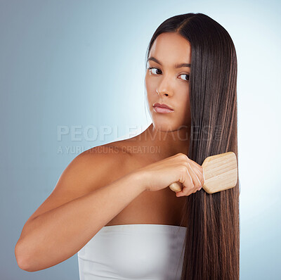 Buy stock photo Hair care, studio and woman with brush on strong hairstyle for treatment, conditioner and style on mockup space. Keratin shine, straight haircut and Brazilian model girl isolated on blue background