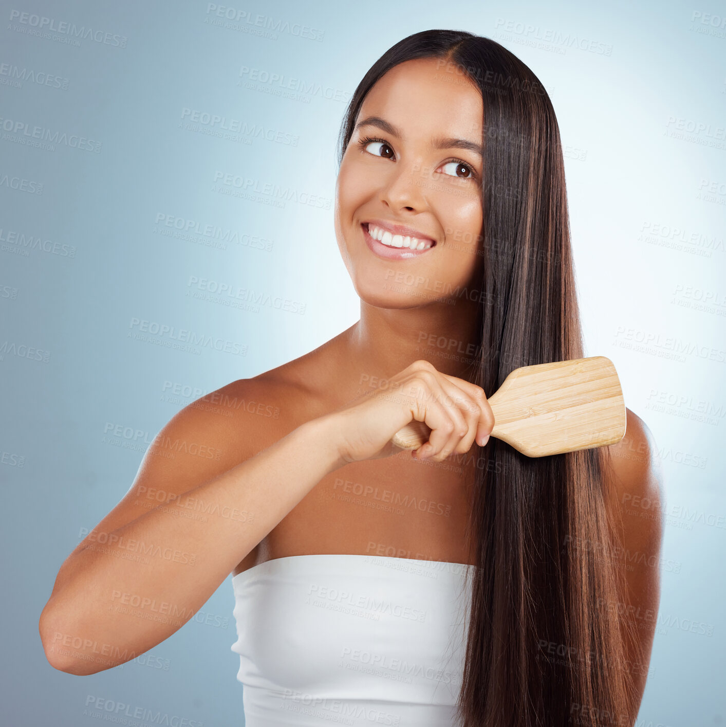 Buy stock photo Hair care, studio and happy woman with brush on straight hairstyle for treatment, style and healthy growth. Keratin shine, strong haircut and smile on Brazilian model girl isolated on blue background