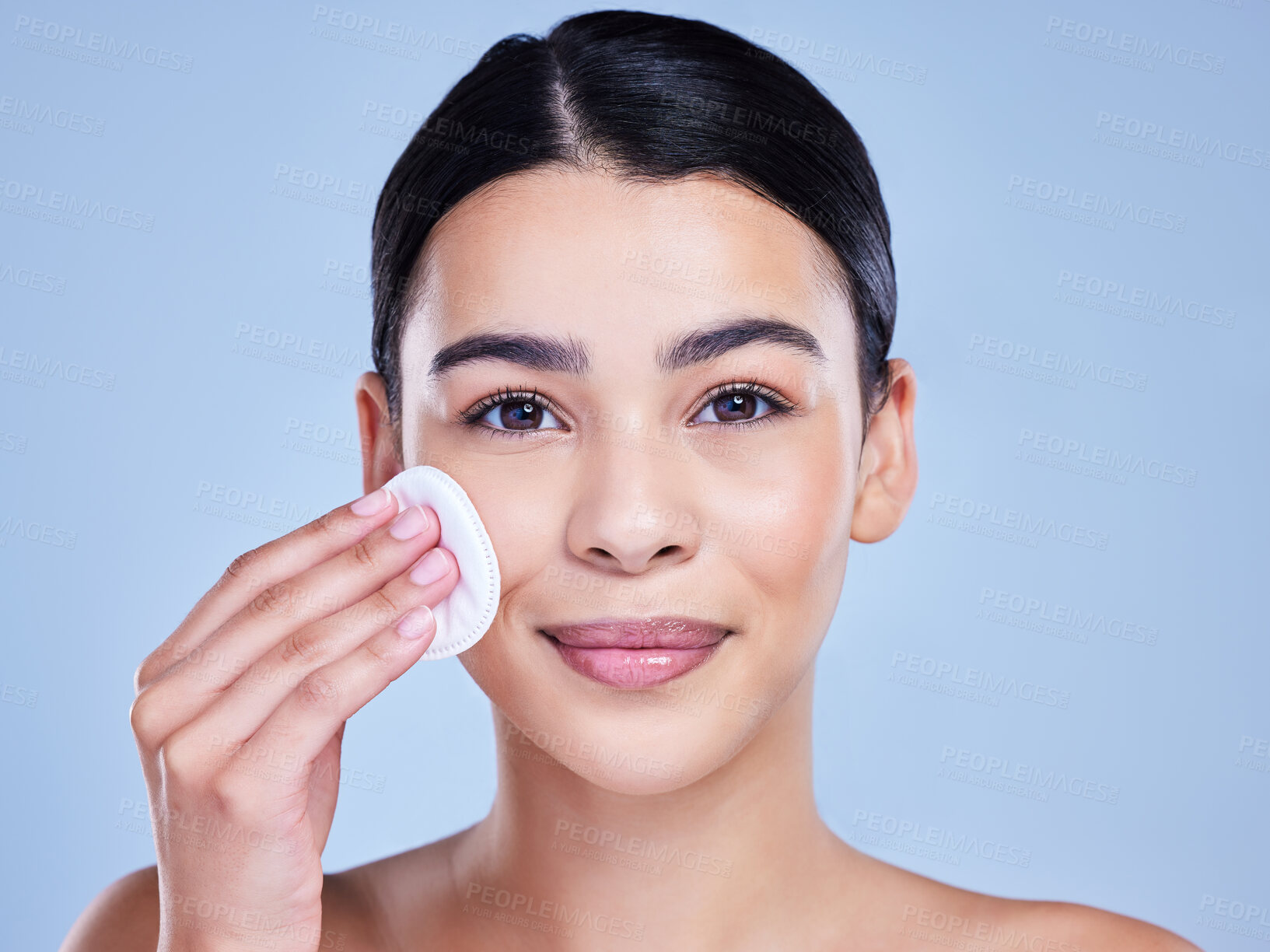Buy stock photo Cotton pad, skincare and portrait of woman in studio with natural, health and facial routine for hygiene. Beauty, glow and person with dermatology treatment with cosmetic product by blue background.
