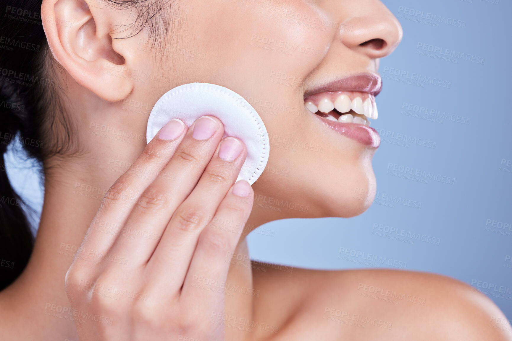 Buy stock photo Cotton pad, skincare and face of woman in studio with natural, health and facial routine for hygiene. Beauty, glow and person with dermatology treatment with cosmetic product by blue background.