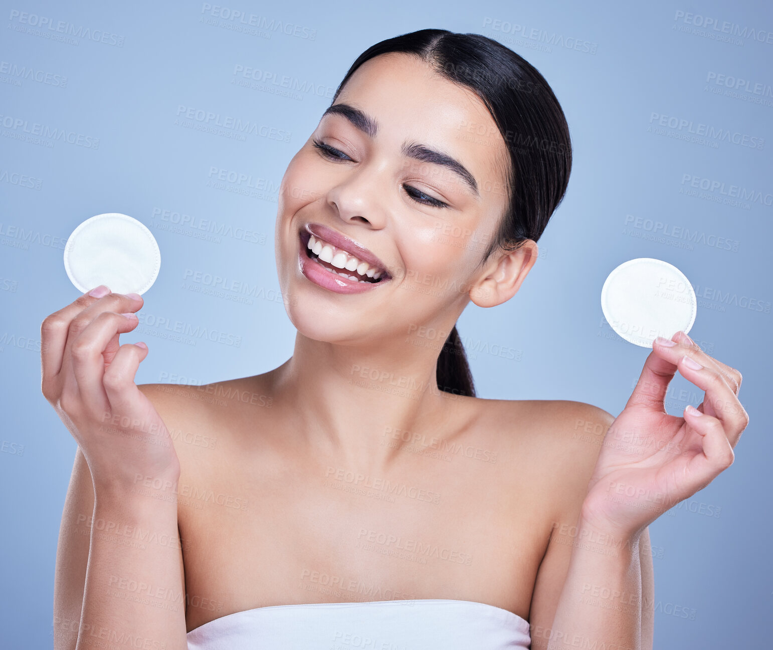 Buy stock photo Cotton pad, cleanse and woman with skincare in studio with natural, health and facial routine for hygiene. Beauty, glow and person with dermatology treatment with cosmetic product by blue background.