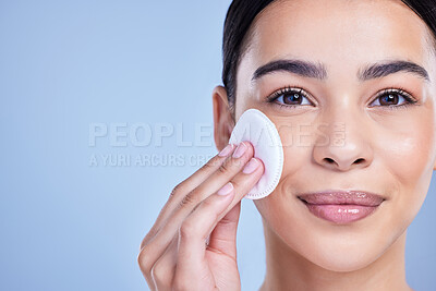 Buy stock photo Cotton pad, beauty and woman in studio with natural, health and facial routine for hygiene. Skincare, mockup and female person with face dermatology treatment with cosmetic product by blue background