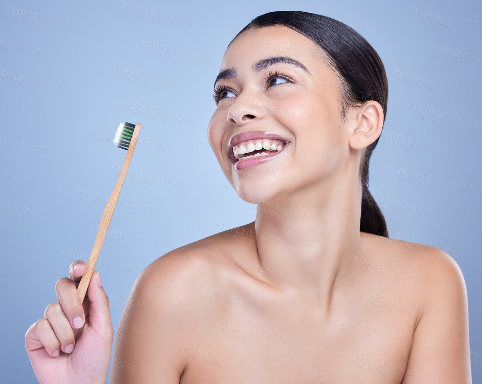 Buy stock photo Happy, girl and thinking in studio with toothbrush for brushing teeth, mouth hygiene or dental care for plaque. Woman, thoughts and blue background for whitening, wellness and oral health or cleaning