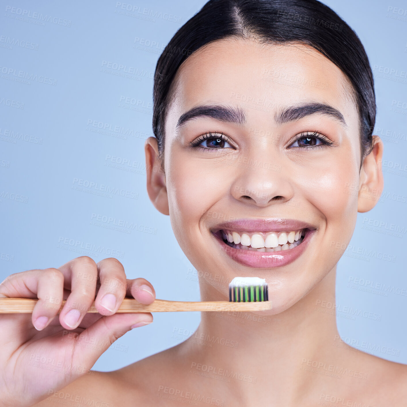 Buy stock photo Happy, bamboo toothbrush and portrait of woman isolated on blue background for smile. Studio, eco friendly or face of model with wood brush or paste for brushing teeth, dental cleaning or oral health