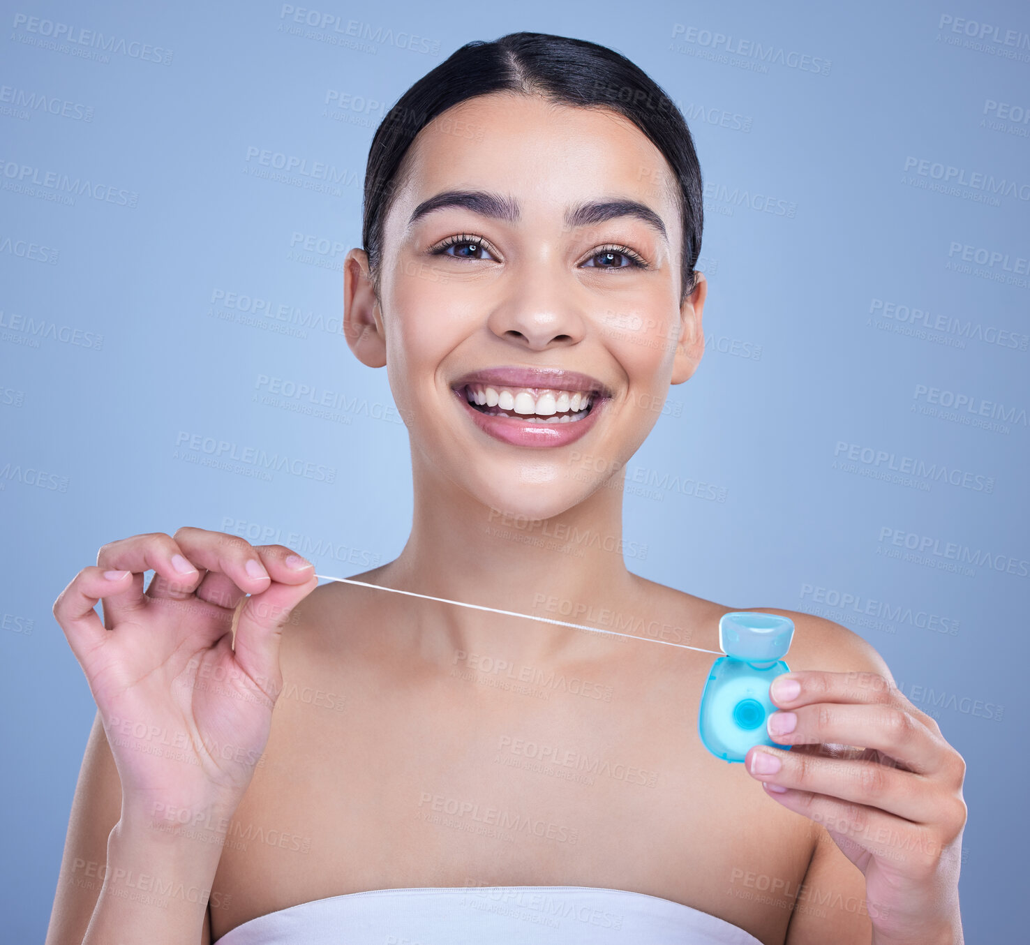 Buy stock photo Dental floss, smile or portrait of woman in studio on blue background for cleaning or oral hygiene. String, dentistry and model with product for tooth care to prevent cavity, decay or gum disease