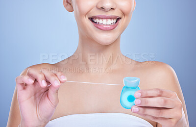 Buy stock photo Dental floss, smile or hands of woman in studio on blue background for cleaning or oral hygiene. String closeup, dentistry or model with product for tooth care to prevent cavity, decay or gum disease