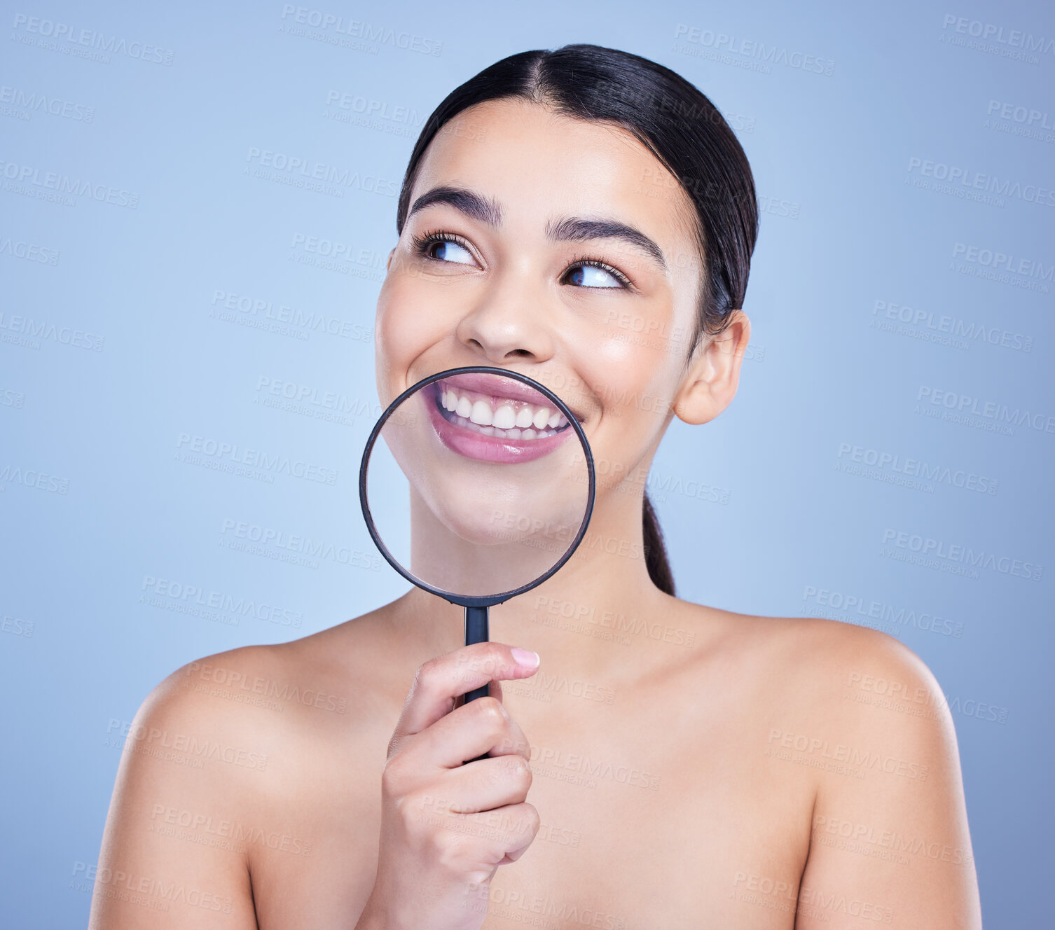 Buy stock photo Woman, studio and happy with magnifying glass for oral care or hygiene in on blue background. Female person, investigation and smile for dental or gum health with teeth whitening and canal procedure
