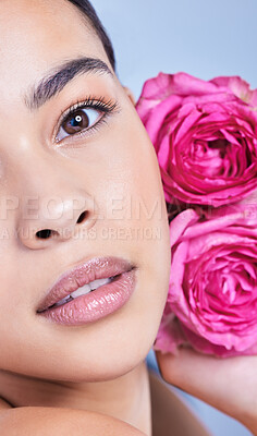 Buy stock photo Portrait, roses or woman with flowers or natural beauty on blue background with herbs, wellness or glow. Face, girl or model in studio with floral cosmetics, plants or skincare for facial results