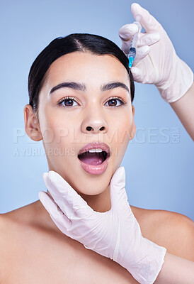 Buy stock photo Woman, hands and portrait for facelift with needle in studio on blue background for grooming and beauty. Female person, aesthetics and surprised with cosmetics for skincare, filler and anti aging