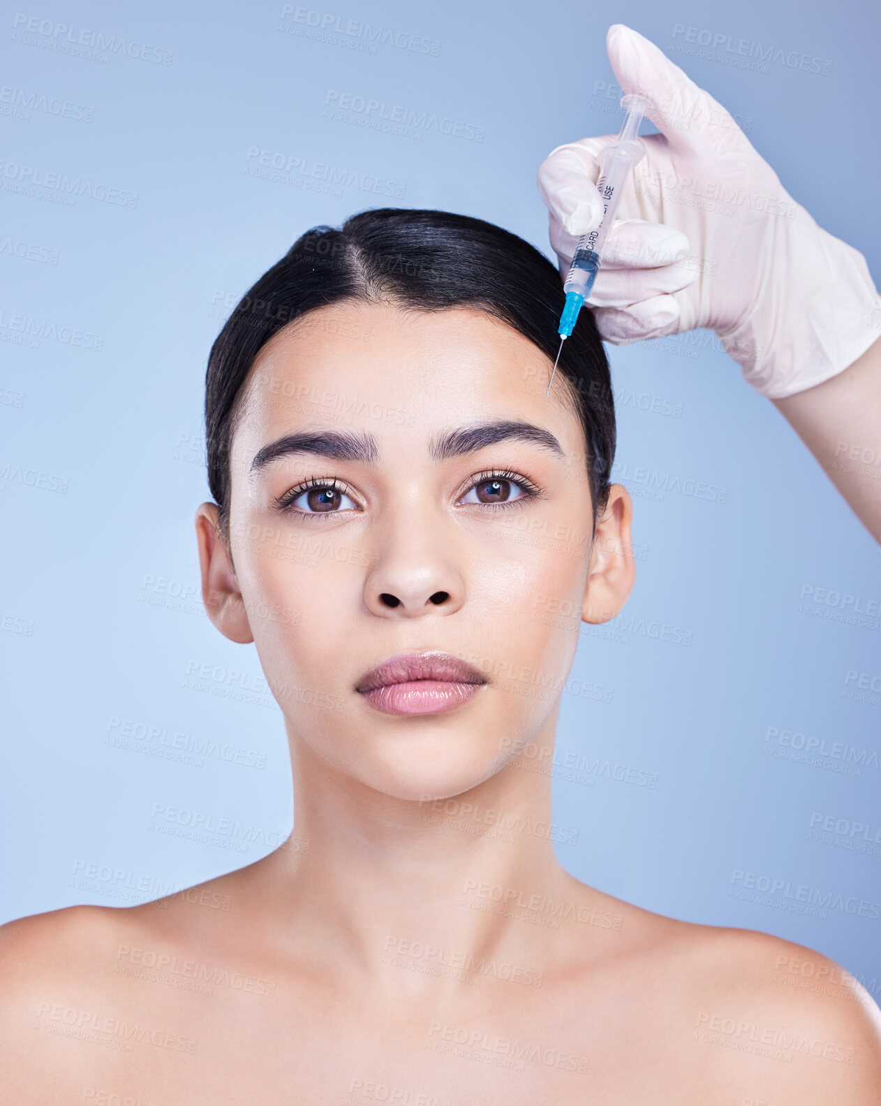 Buy stock photo Portrait, woman and injection on face for skincare filler, plastic surgery or dermatology toxin. Facial, beauty or syringe for medical treatment, collagen cosmetic or change on blue studio background